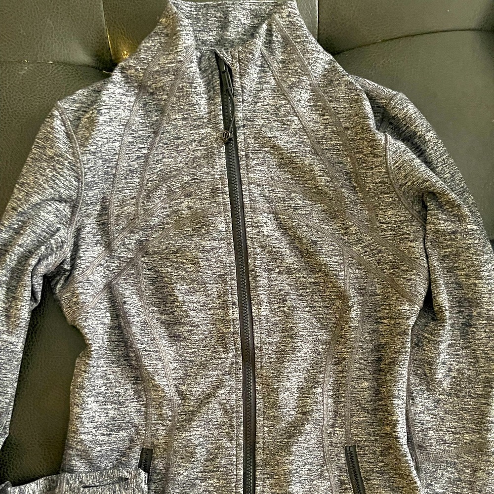 Lululemon size 8 running jacket, never worn, just pulled tags off.